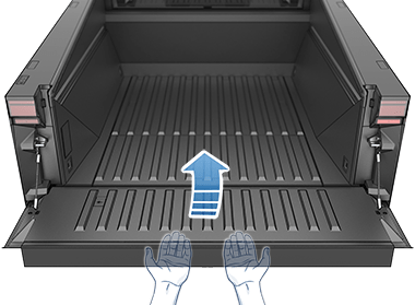 Грузовая платформа с открытым задним бортом и руками, расположенными под ним для демонстрации закрытия