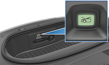 Кнопка внутри переднего багажника с изображением автомобиля с открытым багажником.