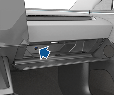 Открытый перчаточный ящик, в котором виден USB-накопитель в USB-порту