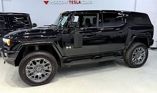 GMC Hummer SUV EV черного цвета 2024 года на 22 колёсах фото 2